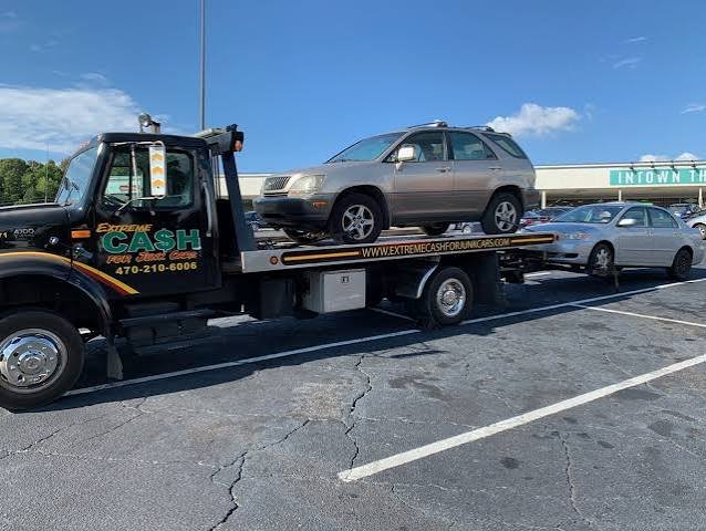 Extreme Cash tow truck picking up an SUV